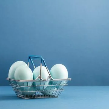 Dyed blue Easter eggs in the basket. Easter holiday concept. Stock Photos
