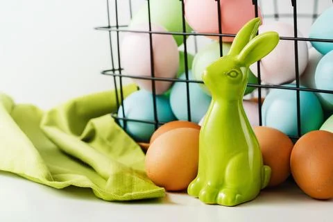 Dyed Easter eggs in the basket. Easter holiday concept. Stock Photos