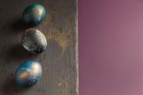 Dyed easter eggs with with beautiful flowers on a purple background. Pattern 스톡 사진