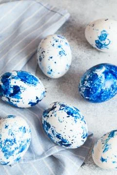 Dyed Easter eggs. ?lassic blue Easter eggs on the grey background. Blue speck Stock Photos