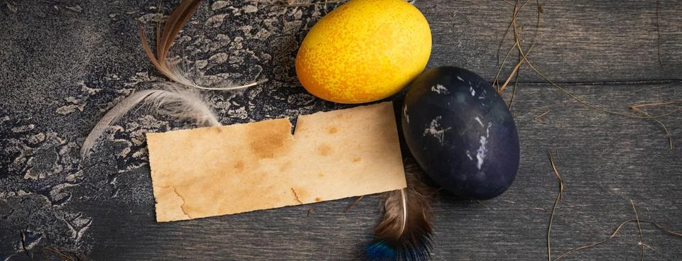 Dyed Easter eggs painted with natural dye on old background, banner Stock Photos