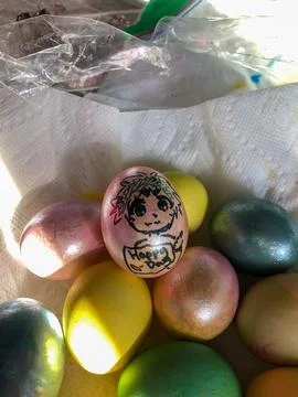 Dyed Easter Eggs Sitting in a Towel Stock Photos