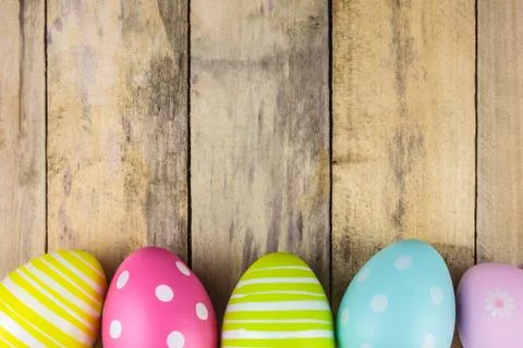 Dyed easter eggs on a wooden background Фото