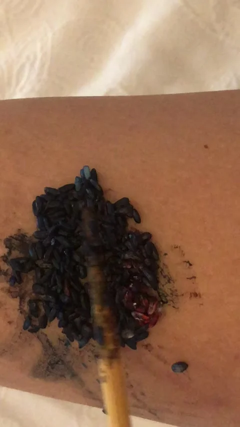 Dyed Rice Texture Rubbing On Leg Food Contact Close-Up Stock-Footage 333062971