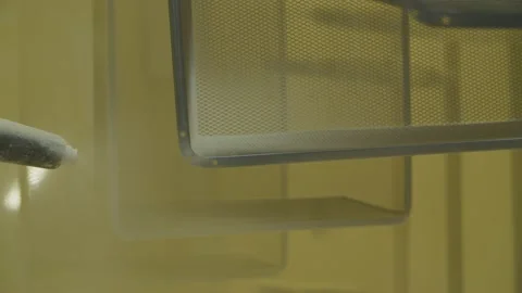 Dyed wired mesh cages moving on the track in the factory Stock Footage 153468495