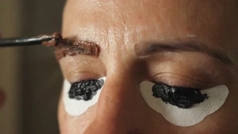Dyeing eyebrows with henna apply applying Stock Footage 134287019