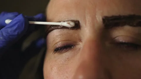 Dyeing eyebrows with henna apply applying Stock Footage 135240028
