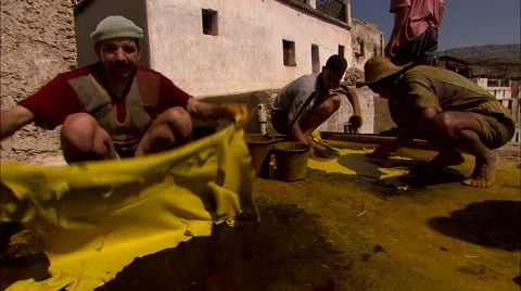 Dyeing yellow skins on rooftop Stock Footage 55027395