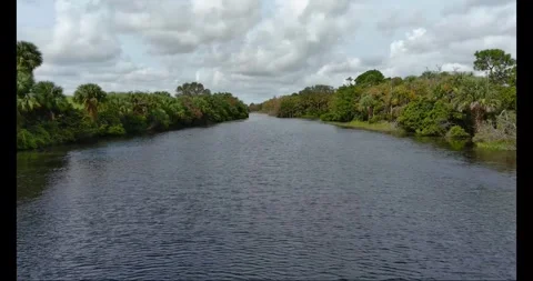 Dyer Park Lake fly Low over water west 3 then elevator up Stock Footage 267046630