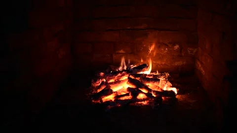 Dying fire in an old fireplace Stock Footage 138739978