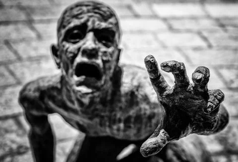 DYING MAN STATUE Stock Photos