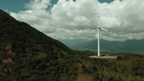 Dynamic 4K Aerial View of Wind Turbine in Scenic Mountain Landscape Stock Footage 323838379