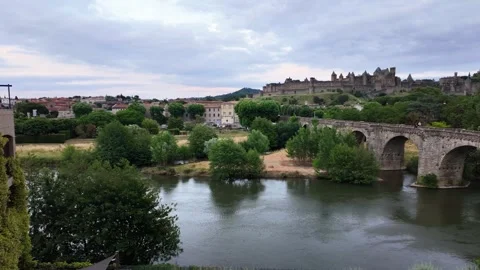 Dynamic 4K UHD panning shot of historic stone bridge and medieval castle over Stock-Footage 347140703