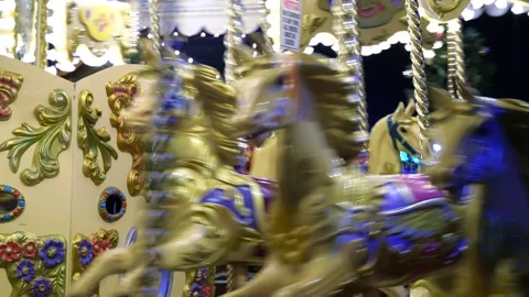Dynamic 4K View: Carousel Galloper Horses in Motion at Night Stock Footage 256985483