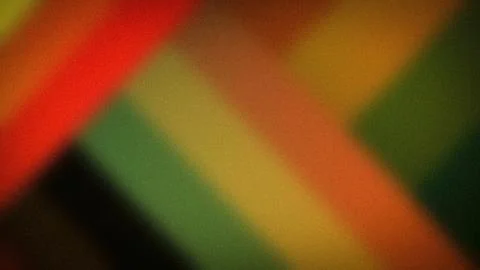 Dynamic abstract 4K grainy gradient background with red orange and green colo Stock Illustration