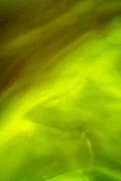 A dynamic abstract background with a blend of vibrant green and yellow colo.. Stock Photos