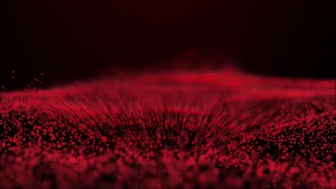 A dynamic abstract background video featuring a wave of vibrant red particles. Stock Footage 312451090