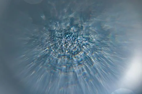 Dynamic abstract blue background with radiant light burst, shimmering textu.. Foto stock