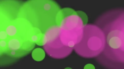 Dynamic abstract circles blurred pink and green circles in motion on black Vídeos de archivo 253951920
