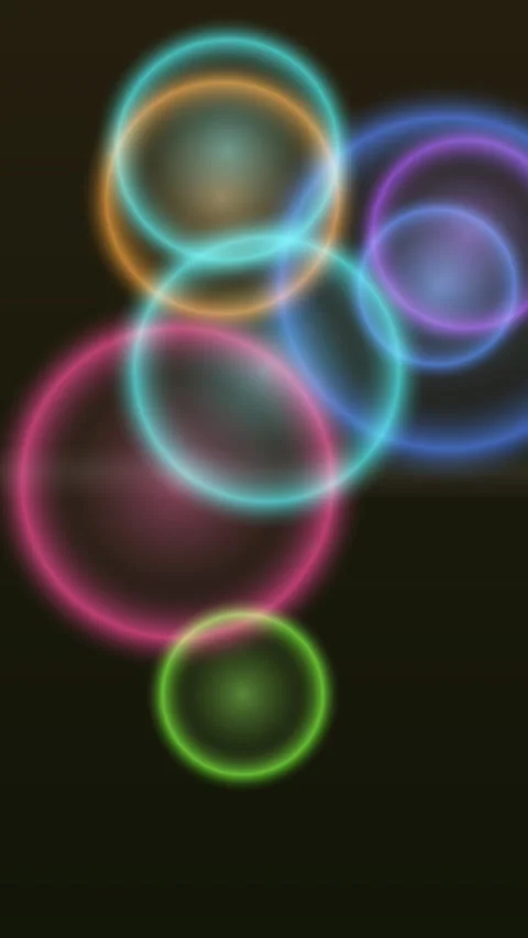 Dynamic abstract circles pulsate with vibrant color against a dark backdrop Stock Footage 327946306