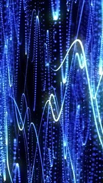 Dynamic abstract image of glowing blue particle waves and light trails over a Stock Photos