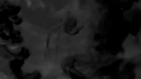 Dynamic abstract patterns emerge with fluid movements in dark tones 動画素材 320388105