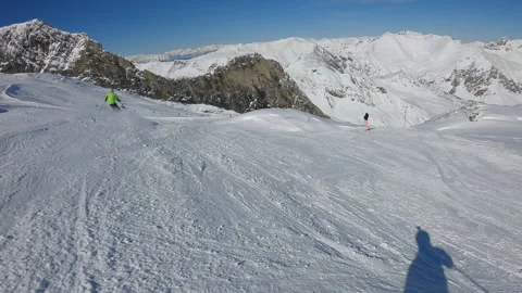 Dynamic, action oriented scene of a skier on a snowy slope Stock Footage 330384307