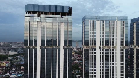 Dynamic aerial capture of a vibrant tropical city skyline featuring Stock Footage 325199963