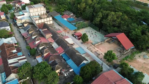 Dynamic aerial perspective showcasing a densely populated tropical communit.. Stock Footage 339037569