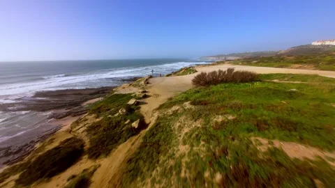Dynamic aerial shot of ocean waves meeting rugged coastline; Ericeira Vídeo Stock 346369777