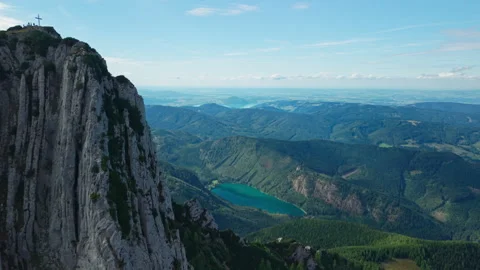 Dynamic aerial view of Alberfeldkogel peak and Langbathsee lake Austrian Alps Видео 344431892