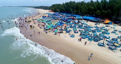 Dynamic aerial view of packed beach goers in South East Asia. Stock Footage 123254056
