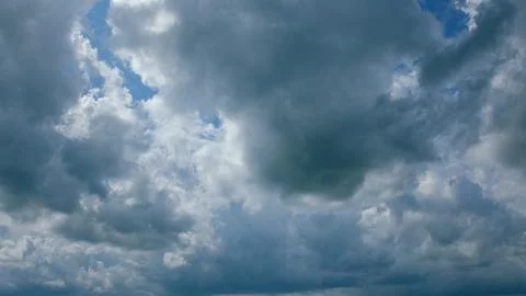 Dynamic and EverChanging Cloud Patterns Gracefully Moving Across a Clear Blue Sk Stock Photos
