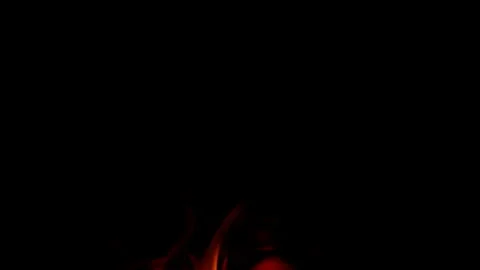 Dynamic and mesmerizing flames are dancing elegantly in the surrounding darkness Stock Footage 311815612