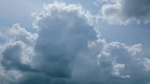 Dynamic and Stunning Cloud Patterns Forming Beautifully in a Clear Blue Sky Abov Stock Photos