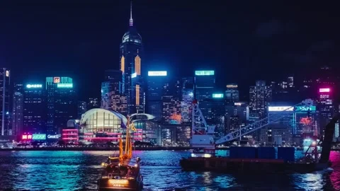 A dynamic and vibrant night scene of Hong Kong's Tsim Sha Tsui area, captured Video stock 338280486