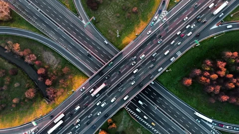 Dynamic Arial View of a Bustling Highway Intersection in Fall Stock-Footage 324935951