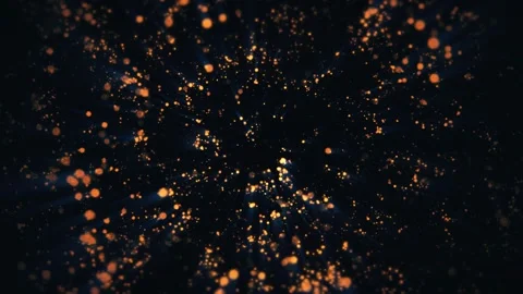 A dynamic array of golden particles moves gracefully against a dark backdrop Stock Footage 307494866