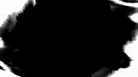 A dynamic black ink splash stands out on a white background, ideal for creative Stock Footage 310544382