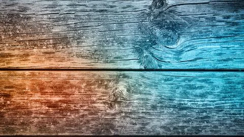 A dynamic blend of orange and blue gradient over natural wood grain texture.. イラスト素材