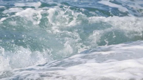 Dynamic blue ocean water swirling with heavy white sea foam. Stock Footage 337406458