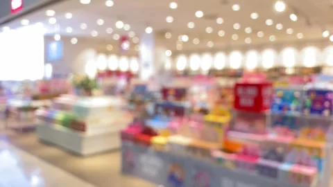 Dynamic blurred retail environment featuring vibrant product displays and l.. Video stock 326033692