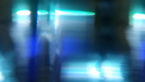 Dynamic blurred video. Flashing colored lights, neon behind the glass. Motion Stock Footage 122291980