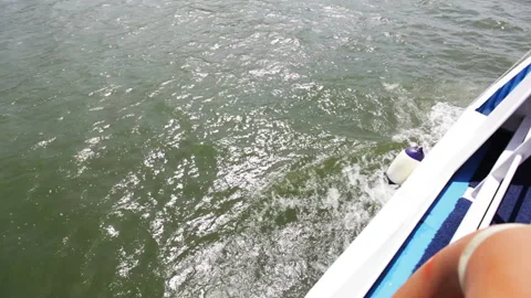 Dynamic Boat View of Water and Wake on a Sunny Day Stock Footage 310669298