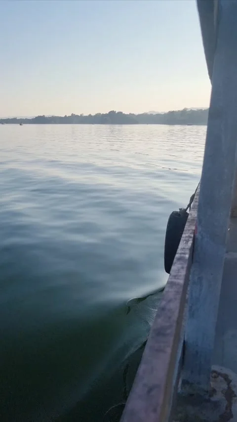 Dynamic Bow-Level View of Boat Navigating Serene Waters Stock Footage 304154473