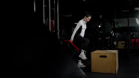Dynamic Box Jump Exercise by Female Athlete in Gym. Woman executing an explosive Video stock 264580850