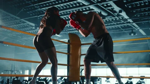 Dynamic Boxing Training Session with Male and Female Boxer in Action Stock Footage 270238194