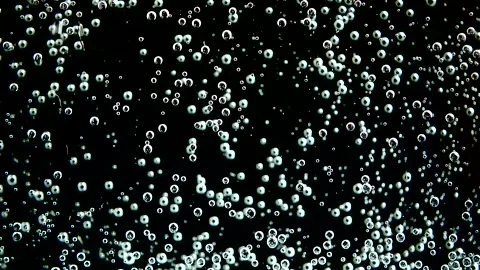 Dynamic bubbling liquid texture in motion. Abstract carbonated foam bubbles risi 库存影片 340450289