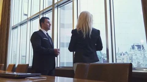 Dynamic business discussion by a panoramic window Stock-Footage 311944642