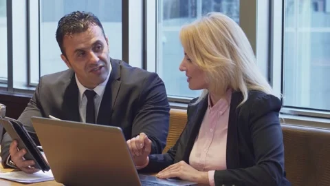 Dynamic business duo collaborating on an exciting new project Stock Footage 311986391